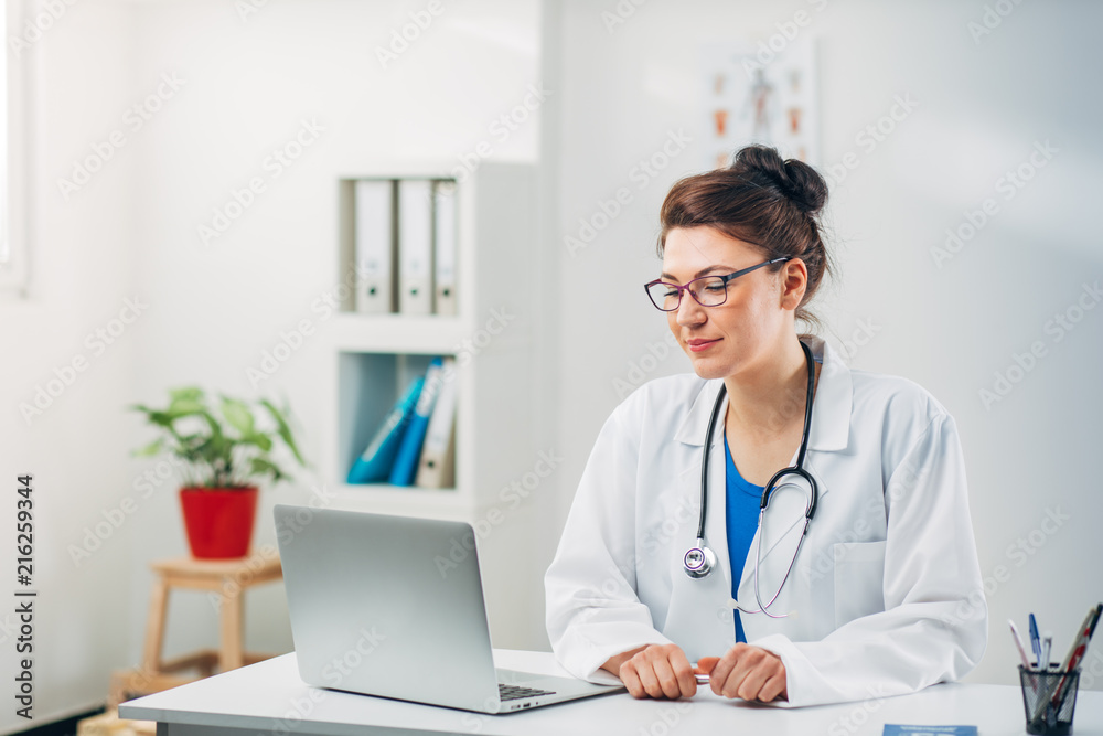 Woman Doctor at her Medical Office Woman Doctor at her Medical Office