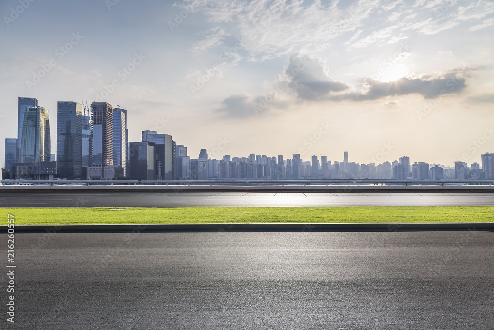 Obraz premium Panoramic skyline and modern business office buildings with empty road,empty concrete square floor