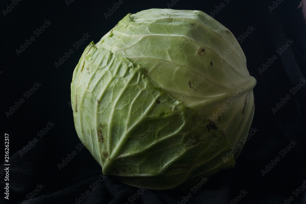Fototapeta premium Cabbage vegetables on black ground
