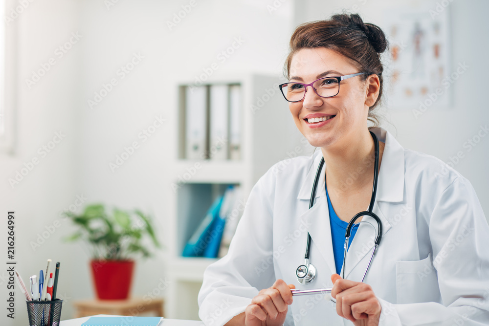 Woman Doctor at her Medical Office Woman Doctor at her Medical Office