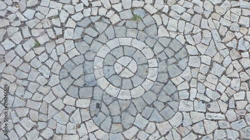 Gray street tiles arranged in a flower pattern