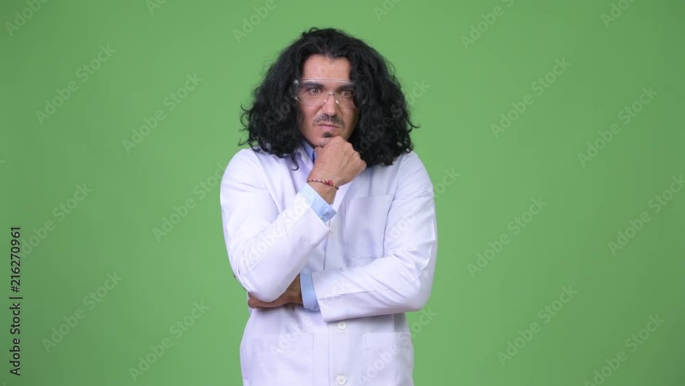 Crazy scientist thinking while wearing protective glasses Crazy scientist thinking while wearing protective glasses