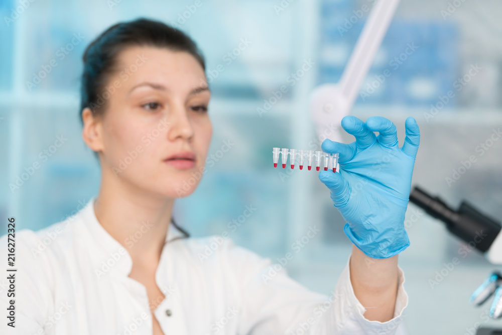 Young woman with genetic research in the laboratory research of cancer diseases Young woman with genetic research in the laboratory research of cancer diseases