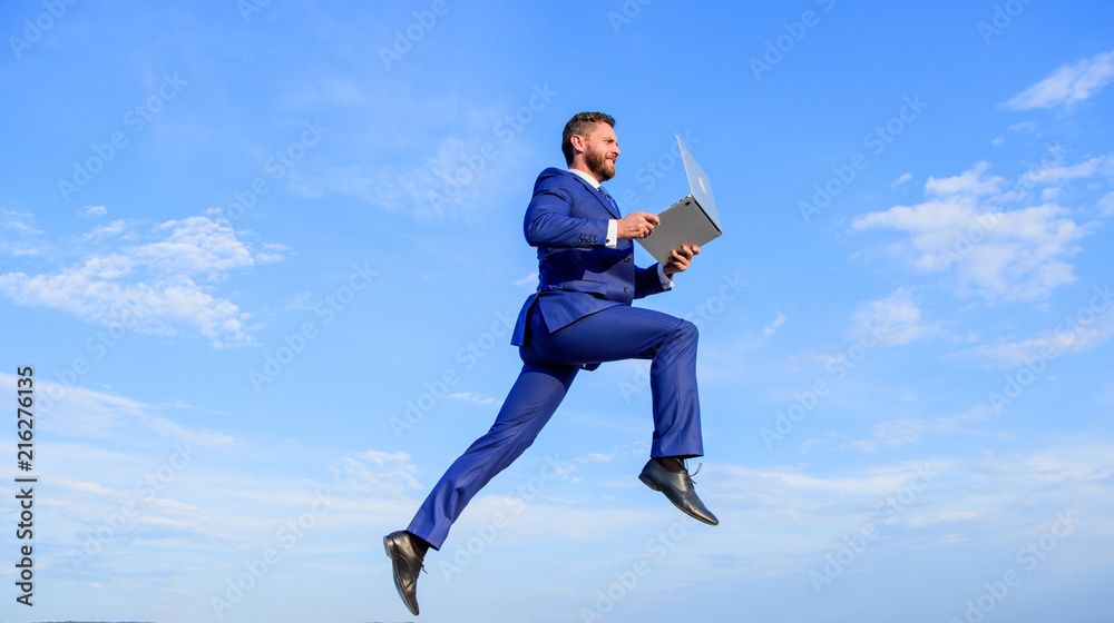 Excellent internet provider raise up quality connection. Internet connection so fast. Boost speed online. Businessman laptop satisfied quality. Man with laptop jump or fly in air blue sky background