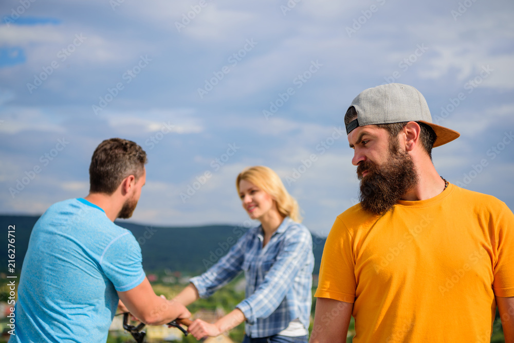 Hipster regretful face in front of couple in love. Man hipster feels lonely couple dating behind him. No romantic in his life. Man regret not asked her go out. Now she dating with another guy Hipster regretful face in front of couple in love. Man hipster feels lonely couple dating behind him. No romantic in his life. Man regret not asked her go out. Now she dating with another guy
