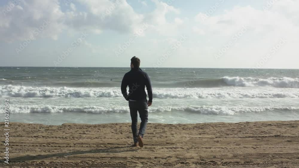 A Conceived Man Walking On Ocean Beach A Conceived Man Walking On Ocean Beach