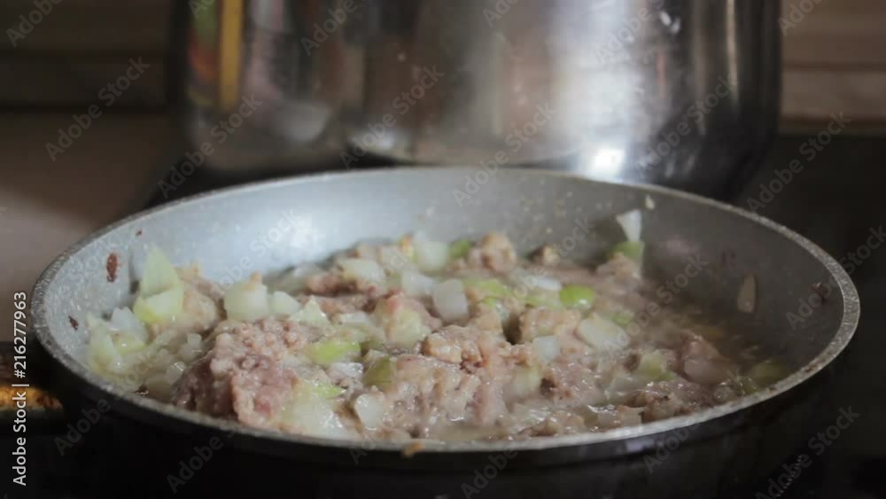 minced meat in a frying pan,juicy minced meat is stewed in a frying pan electric minced meat in a frying pan,juicy minced meat is stewed in a frying pan electric