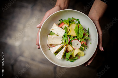 Wallpaper Mural Woman holding a plate of a delicious salad Torontodigital.ca
