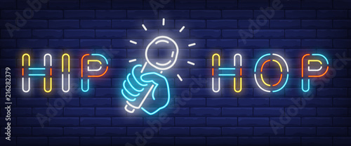 Hip hop neon style banner. Text and hand holding microphone on brick background. Night bright advertisement. Can be used for signs, posters, billboards