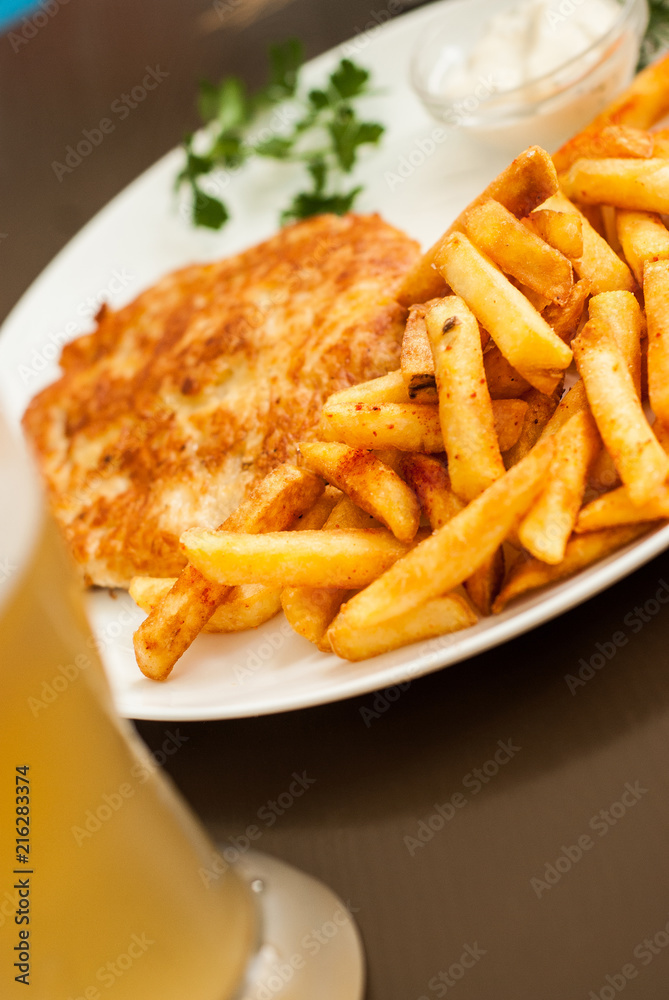 Vienna schnitzel and French fries. Traditional Austrian dish. Vienna schnitzel and French fries. Traditional Austrian dish.