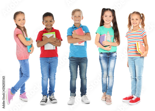 Cute school children with stationery on white background