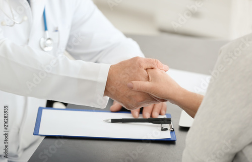 Male doctor and patient sha...