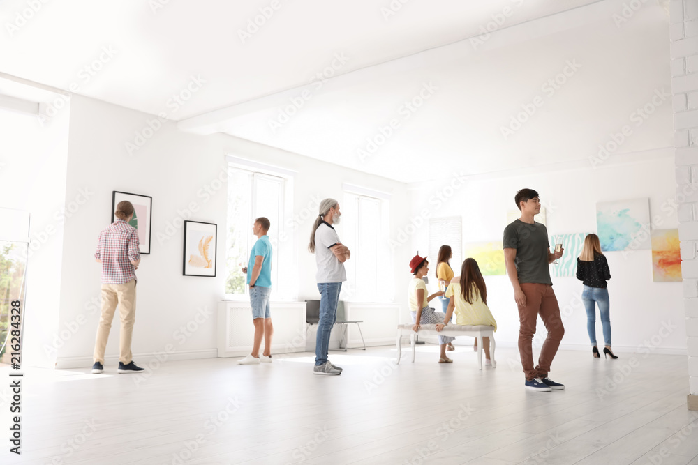 Fototapeta premium Group of people at exhibition in art gallery