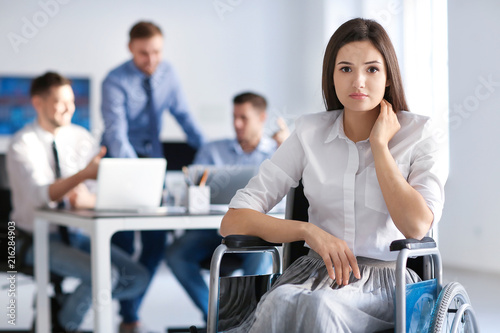 Upset young woman in wheelc...