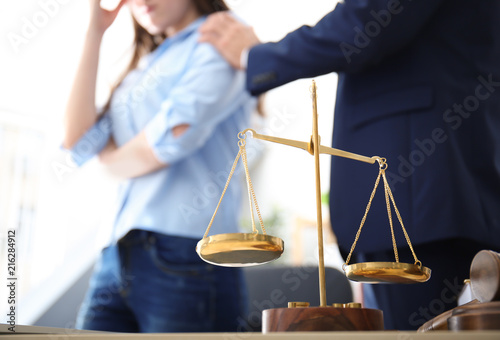 Scales of justice on table ...