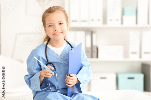 Cute little girl in doctor ...