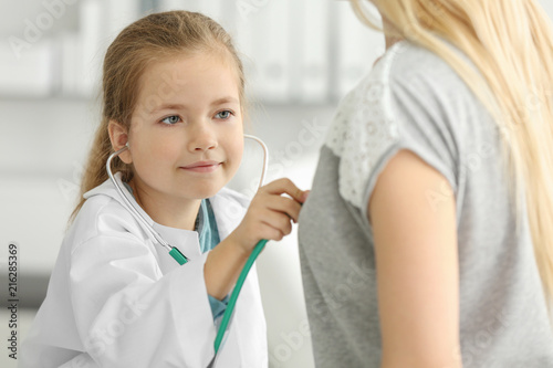 Cute little girl in doctor ...
