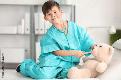 Cute little boy in doctor u...