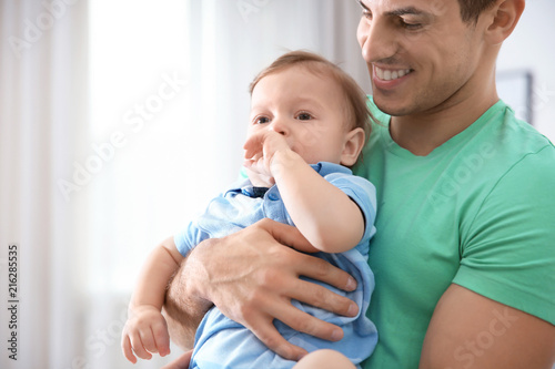 Father with his cute little...
