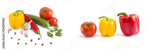 Panoramic view of red tomatoes, yellow pepper and bitter pepper on white background. A composition of multi-colored vegetables on a white background. Red bitter pepper with tomato and green cucumber o