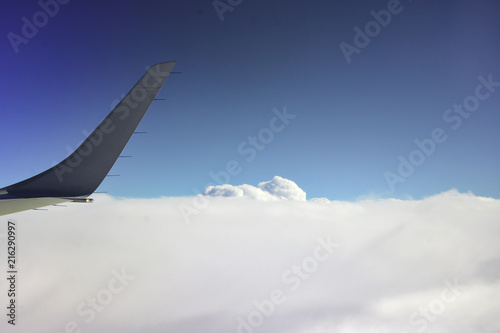 view from the window: Clouds and wing tip