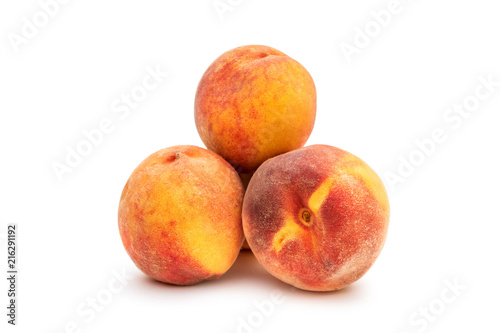 Pile of peaches on white.