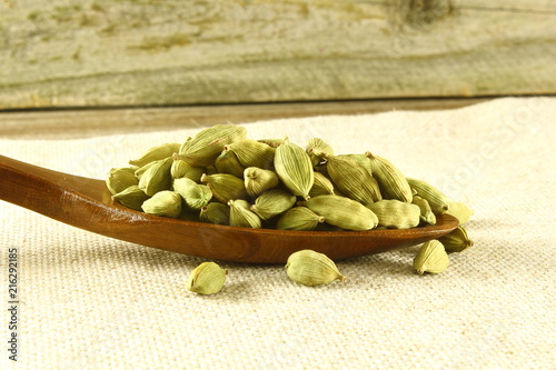 cardamom spice seed pods isolated closeup photo