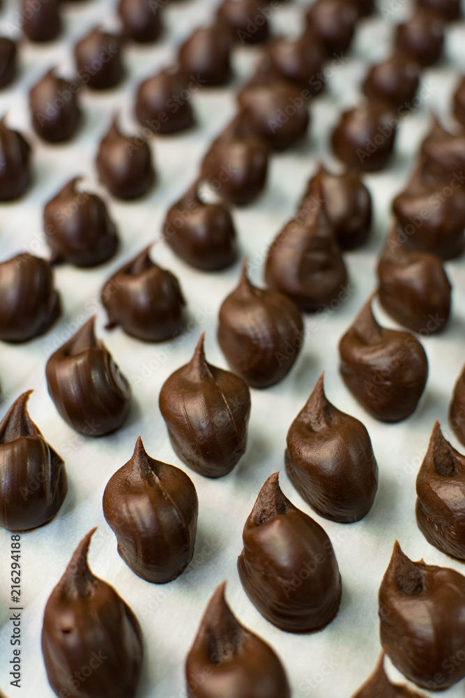 CLOSE UP OF HOW PREPARING MELTING HANDMADE DARK CHOCOLATE TRUFFLES DESSERT CLOSE UP OF HOW PREPARING MELTING HANDMADE DARK CHOCOLATE TRUFFLES DESSERT