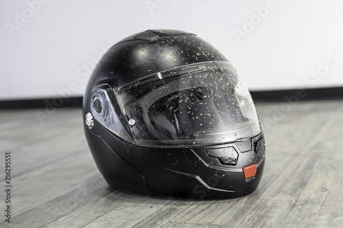 Dirty black full face motorcycle helmet photo
