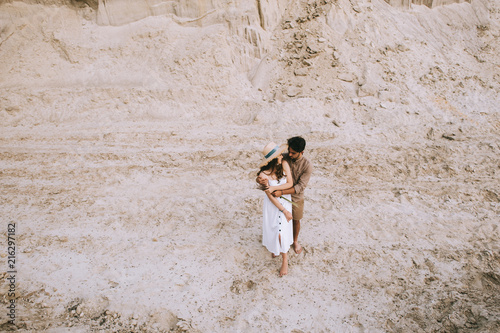 high angle view of young couple hugging in sand canyon © LIGHTFIELD STUDIOS