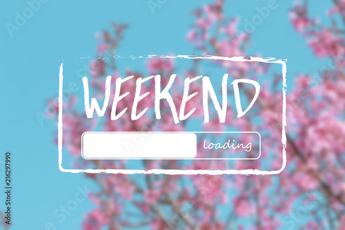 Weekend loading word on Wild Himalayan Cherry Blossoms in spring season (Prunus cerasoides) background photo