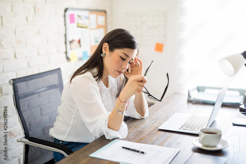 Woman feeling stressed at work Woman feeling stressed at work