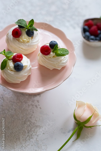 Anna Pavlova dessert with fresh berries. Meringue.