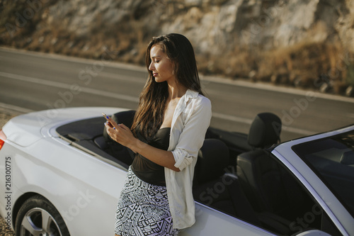 Young woman using mobile ph...