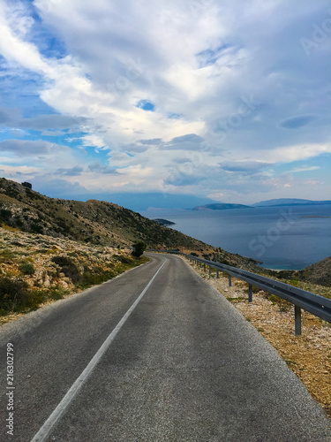 Mountain road with sea view located in island Krk Croatia photo