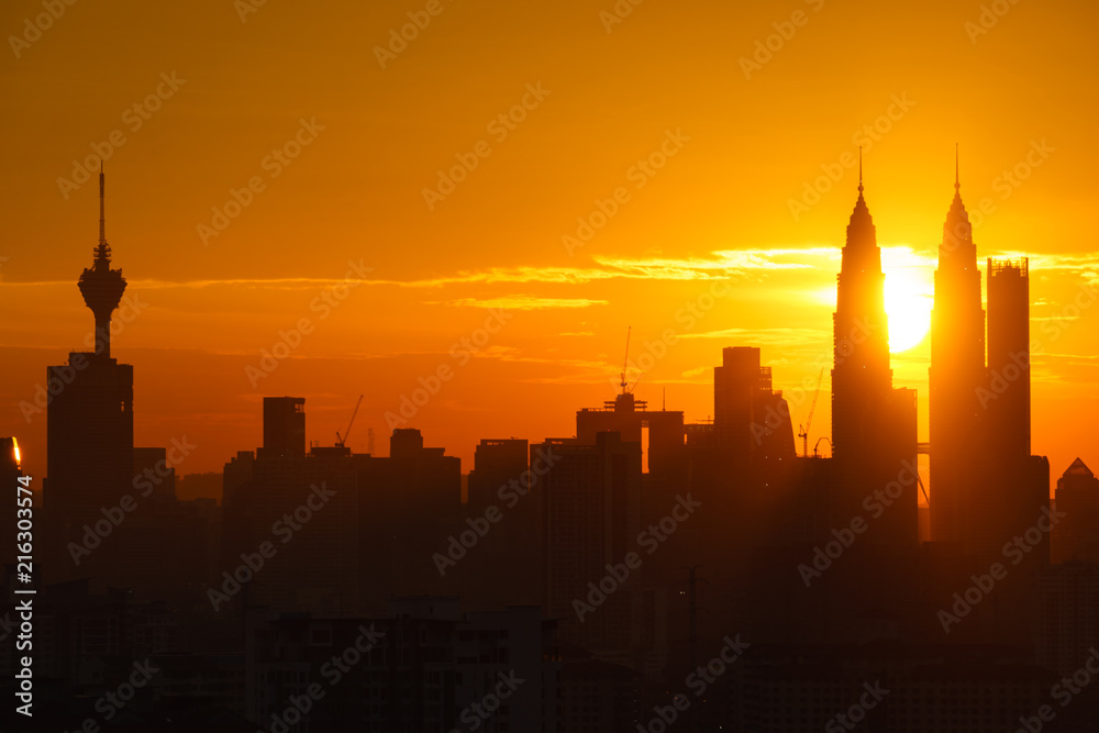 Fototapeta premium Majestic sunset over Twin Towers and surrounded buildings in downtown Kuala Lumpur, Malaysia. 