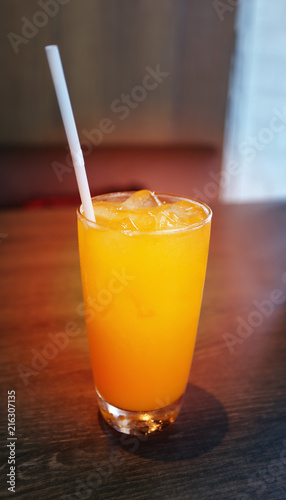 Photo of a close-up of a bright orange juice