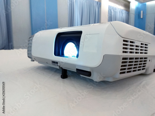 White projector on the table in meeting room