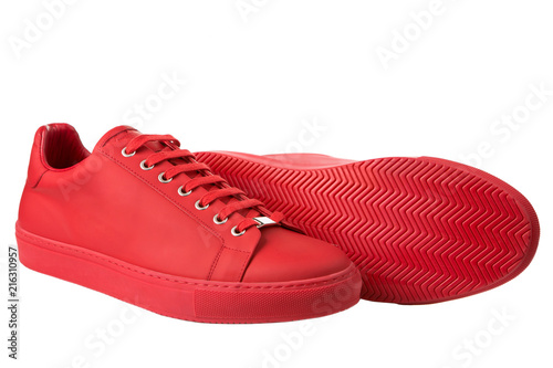 red fashionable men's sports shoes, a pair of shoes made of leather on a white background, isolate