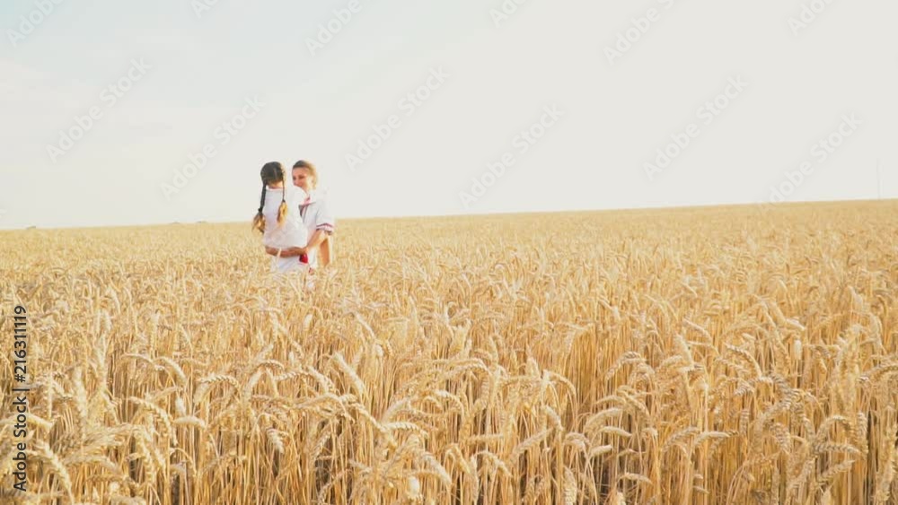 Mom and baby are going through a wheat Mom and baby are going through a wheat