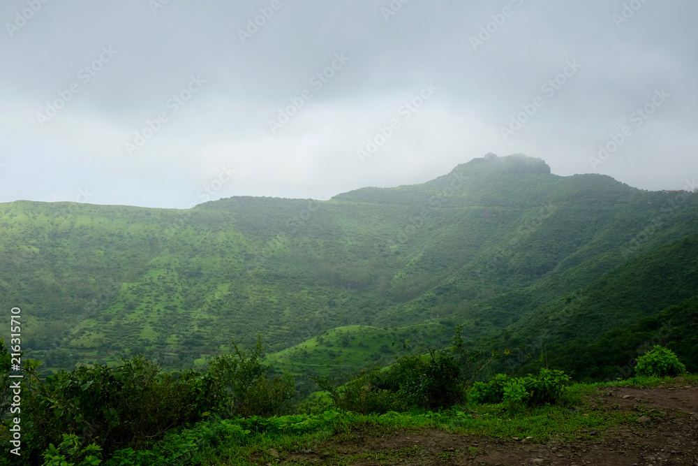 Lush green monsoon nature landscape mountains, hills, Purandar, Pune, Maharashtra, India 