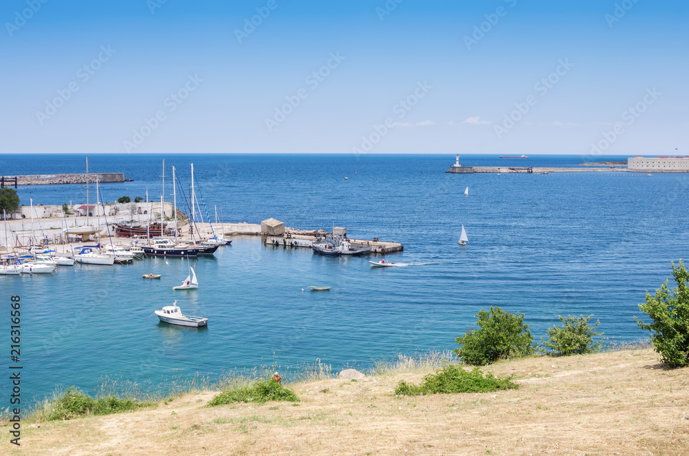 Russia, the peninsula of Crimea, the city of Sevastopol. 06/10/2018: Sevastopol Bay, Marina of the yacht club and Konstantinovskaya battery