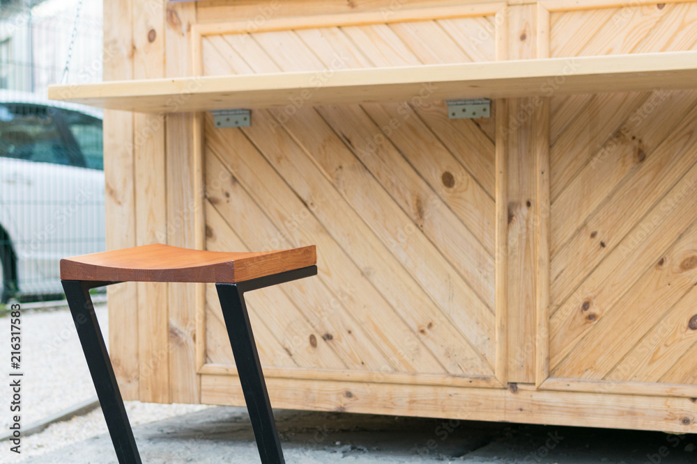 Wooden seat of a street cafe.