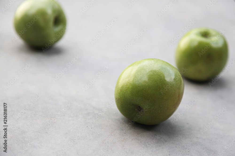 Apple green on grey background. Still life Apple green on grey background. Still life