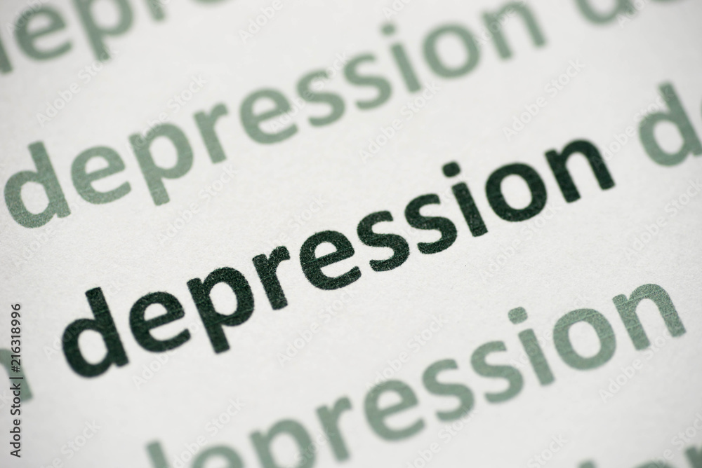 Fototapeta premium word depression printed on paper macro