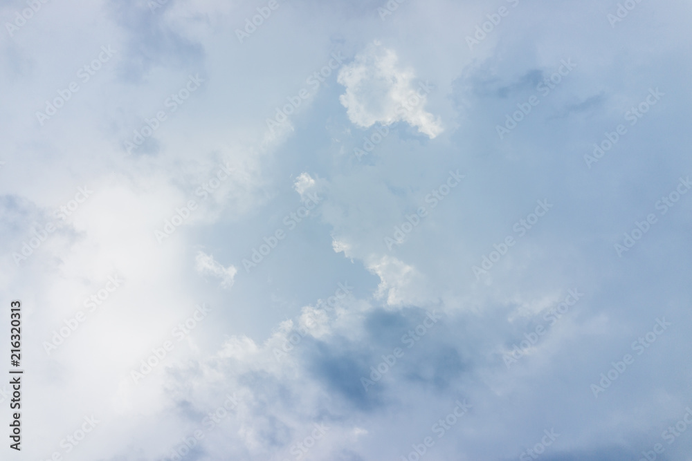 Fototapeta premium Isolated sky cloudscape with fluffy clouds and bright sun with soft rays during solar eclipse Virginia