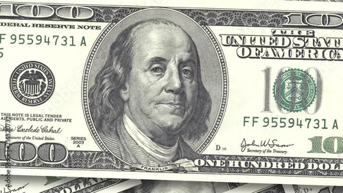 Background with money American bills. Cash money background. fast rotation of paper dollars close-up