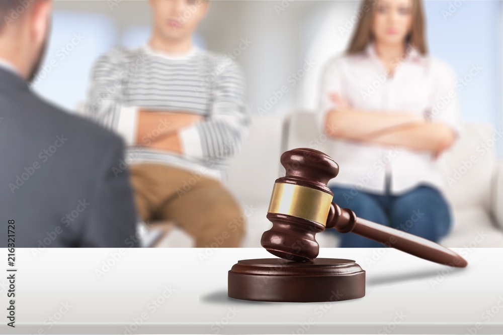 Young couple in lawyer office