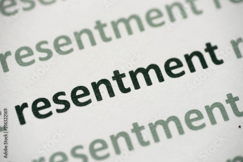 word resentment printed on paper macro