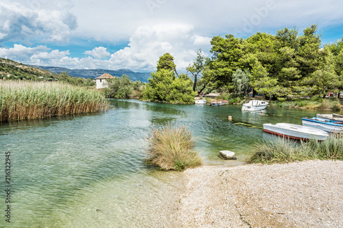 Boats in the beach bay, Pantan, Trogir, Croatia photo